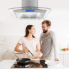 Happy young couple cooking pancakes together